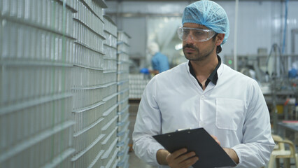 Production control supervisor inspects and controls the operation of each step in the production...