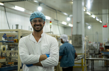 Portrait of production control supervisor inspects and controls the operation of each step in the...