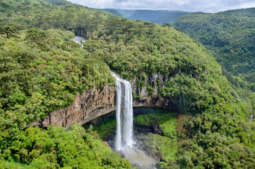 Caracol Falls, a 130 meters waterfall, formed by the Caracol River and cuts out of basalt cliffs in...
