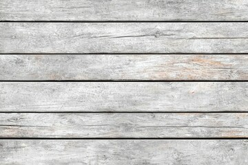 A white wooden board with a few scratches and marks
