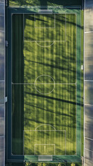Obraz premium Aerial view of well maintained soccer field with vibrant green grass and clear markings, perfect for sports activities