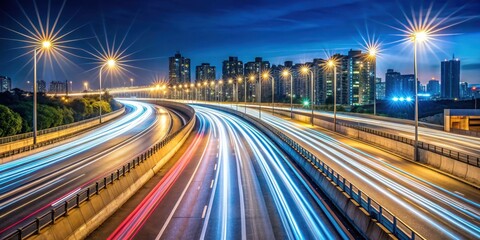 Obraz premium Light trail on urban highway at night , long exposure, city lights, motion blur, speed, transportation, highway