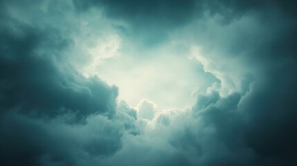 Obraz premium A dramatic sky with swirling clouds illuminated by a soft light.