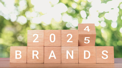 Planning 2025 brands new year symbol. Concept words 2024 Brands to 2025 Brands on wooden blocks. Business 2025 brands New Year concept