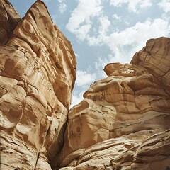 Trail to the Observation Point, Magnificent view of remarkable sandstone formations from a wide viewpoint, Scenic desert canyon trail with towering sandstone walls under a partly cloudy sky.