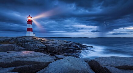 Dramatic lighthouse beam cutting through stormy ocean at night. © tolem929
