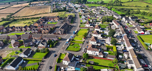 Aerial video of Residential homes Town houses and Businesses in Rasharkin Town Co Antrim Northern...