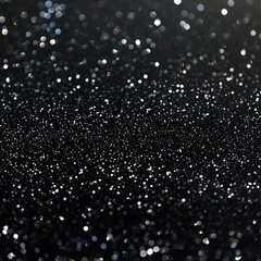 Fototapeta premium Shimmering silver dots on a black background