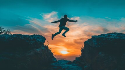 Silhouette of a man jumping over a gap at sunset.