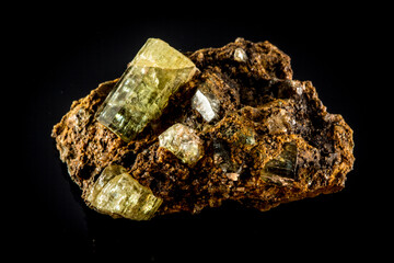 A Rubellite Tourmaline rock with a yellowish color and brownish color
