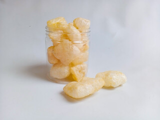 Kerupuk kulit sapi or rambak or beef skin crackers in a plastic jar, crackers with a savory and crispy taste