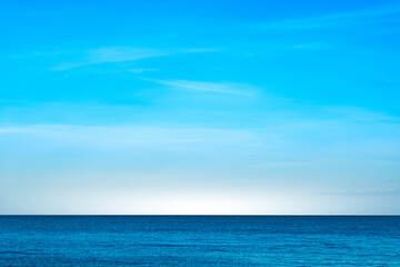 Nature of the beach and sea Summer with sunshine, sandy beaches, clear blue waters sparkling against the blue sky. On an island with good ecology and environment Background for summer vacation 