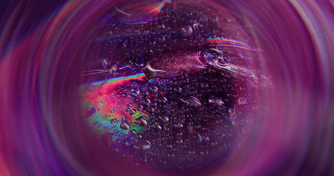 Rainbow bubbles. Blurred colorful droplet. Defocused leak purple rays flickers water beam lens flare on abstract art light background.