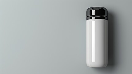 White thermos bottle with black lid on gray background.