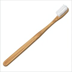 A bamboo toothbrush with a wooden handle and soft bristles, promoting eco-friendly oral hygiene.