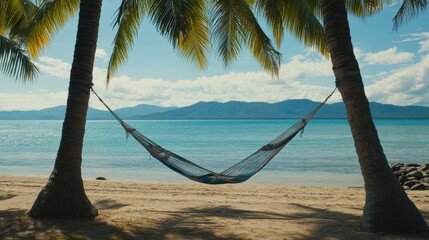 Relaxing Hammock Between Palm Trees on Tropical Beach with Ocean View