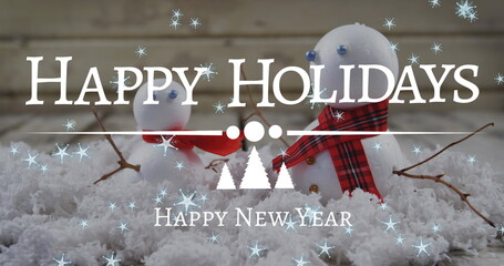 Image of christmas greetings text over snowmen and stars © vectorfusionart
