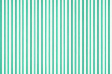 a close up of a green and white striped wallpaper