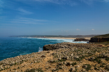 rugged cliffs and sand beaches at Praia Do Bordeira Beach.