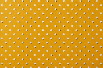 yellow and white polka dot pattern on a yellow background