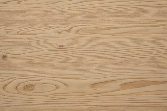 a close up of a wooden surface with a knot in the middle