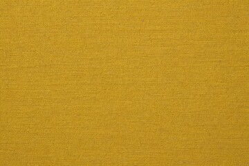 Fototapeta premium a close up of a yellow fabric with a small white stripe