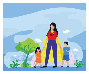 Superhero Mom Standing Outdoors Holding Hands With Two Children.