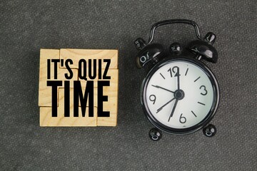 puzzle bell and bell clock with the word Its Quiz Time. the concept of answering quizzes or quiz...