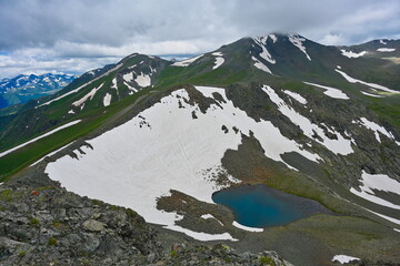 Snow on the mountain slopes at the Arkhyz Pass