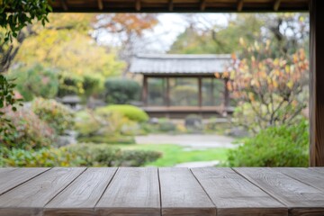 Wooden table overlooking autumnal Japanese garden.
