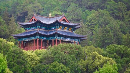 Scenic views of Black Dragon Lake Park in Lijiang showcasing traditional architecture amidst lush greenery