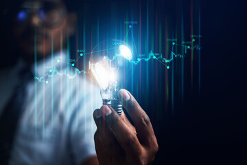 Businessman using graphic technology to analyze corporate income through laptop of annual overview, business appraisal concept in 2025