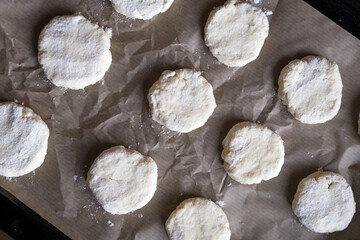 Cookie dough on baking paper. Culinary background.