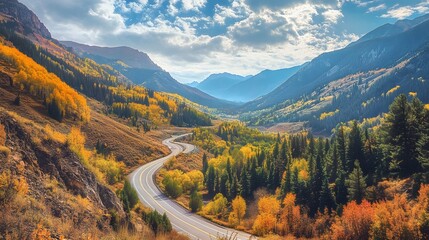 Winding mountain road through autumnal landscape