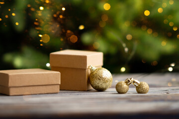 Christmas golden balls and gifts lie on the surface