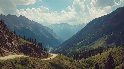 Obraz premium Mountain Road Winding Through Majestic Peaks