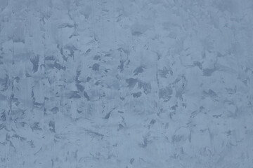 A person riding a snowboard on a snowy terrain, with fresh powder and mountain landscape in the background.