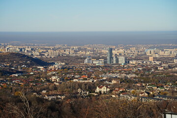Almaty, Kazakhstan - 11.28.2024 : View of the city and heavy smog. Various commercial and...