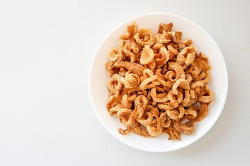 Pork rind, pork cracking,pork snack, in white plate on white background