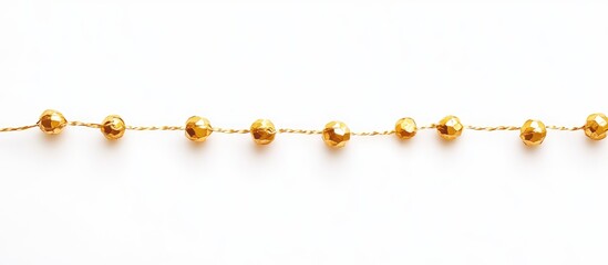 Golden bead garland thread elegantly displayed on a clean white background showcasing festive decoration and design potential