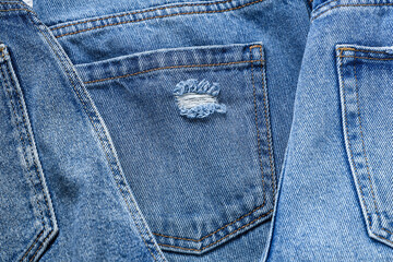 Fototapeta premium Set of stylish blue jeans as background, closeup