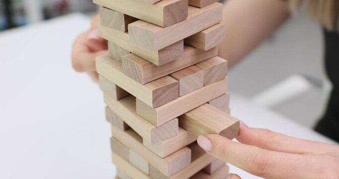 Build a tall tower using block stacking game