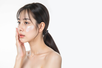 Fototapeta premium Realistic Generative AI of Asian woman applying skincare on white background, Free space for text.