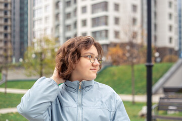 Portrait of a young woman in a big city. Woman in the city.