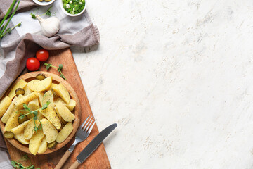 Wooden plate of tasty potato salad with pickled cucumber and tomatoes on white background