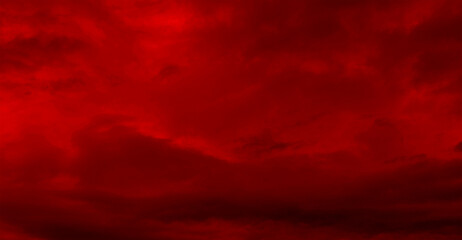 Red night sky background. Blurred photo of dark red sky. Photo can be used for the concept of Halloween and galaxy space background.