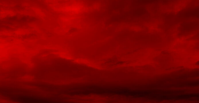Red night sky background. Blurred photo of dark red sky. Photo can be used for the concept of Halloween and galaxy space background.