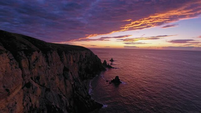 Coastal Sunset with Horizon Cloud Alignment, Vibrant Warm Colors over Ocean Cliff, for Landscape Art