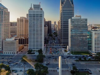 High-angle view of Detroit city streets and skyscrapers. Busy urban scene with cars, pedestrians, and modern architecture. DOWNTOWN, DETROIT, MICHIGAN, UNITED STATES