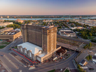 Aerial view of the Detroit Terminal Warehouse undergoing renovations. Construction crews work on the historic building. MICHIGAN CENTRAL, DETROIT, MICHIGAN, UNITED STATES